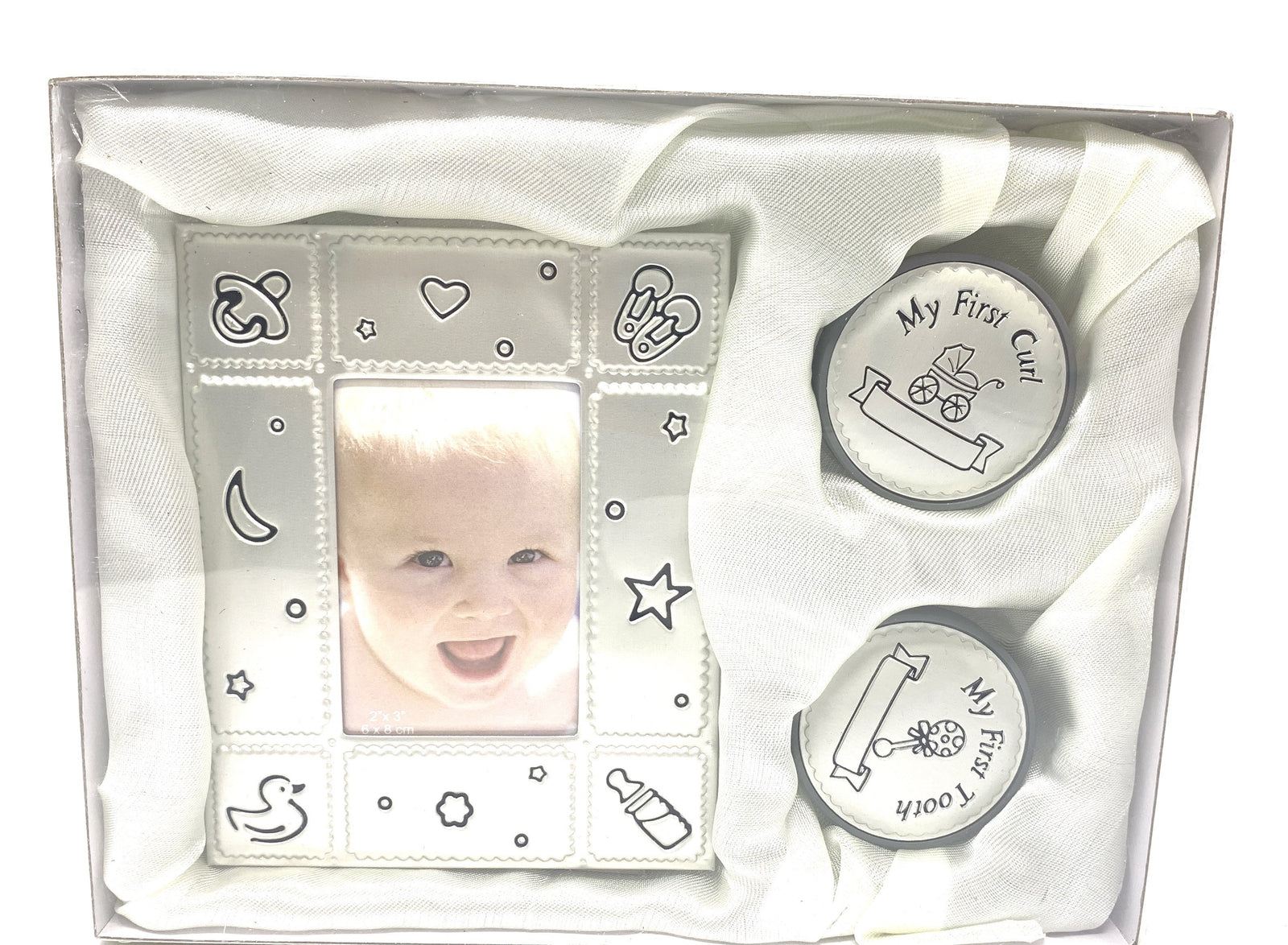 Baby photo frame and 'My First Curl' coin set in a clear box