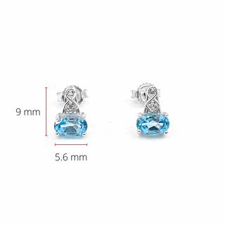 Pendientes de oro blanco de 10 quilates con topacio azul genuino de 1,20 quilates y diamantes de 0,02 quilates