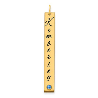 Gold pendant with engraved name 'Kimberley' and a blue gemstone on a white background