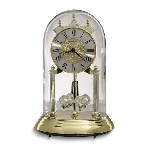Howard Miller Christina Reloj de aniversario de cuarzo con acabado de vidrio y latón