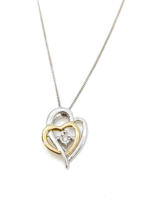 Colgante en forma de corazón con diamantes de 0,15 quilates en oro blanco y amarillo de 10 quilates, 18"