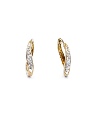 Pendientes tipo argolla con bisagras Huggie de oro amarillo de 10 quilates con diamantes de 0,12 quilates