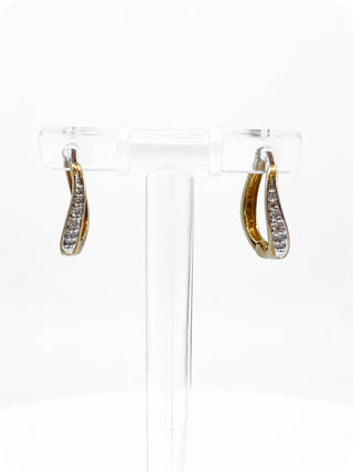 Pendientes tipo argolla con bisagras Huggie de oro amarillo de 10 quilates con diamantes de 0,12 quilates