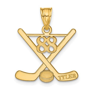 Gold pendant with hockey design and 'Tyler' engraving on a white background