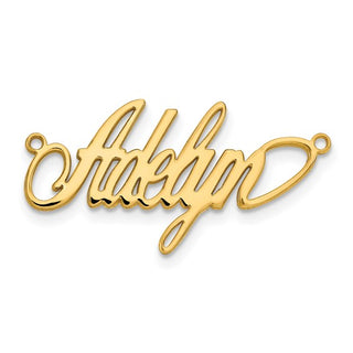 Gold pendant with 'Adele' engraved on a white background