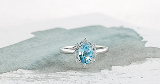 14K White Gold Genuine Oval Aquamarine and 0.16cttw Canadian Diamond Ring, size 6.5