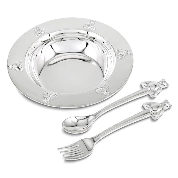Silver plate with floral designs and matching spoon and fork on a white background