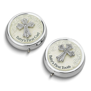 Two silver containers with cross designs, labeled 'Baby's First Curl' and 'Baby's First Tooth', on a white background.