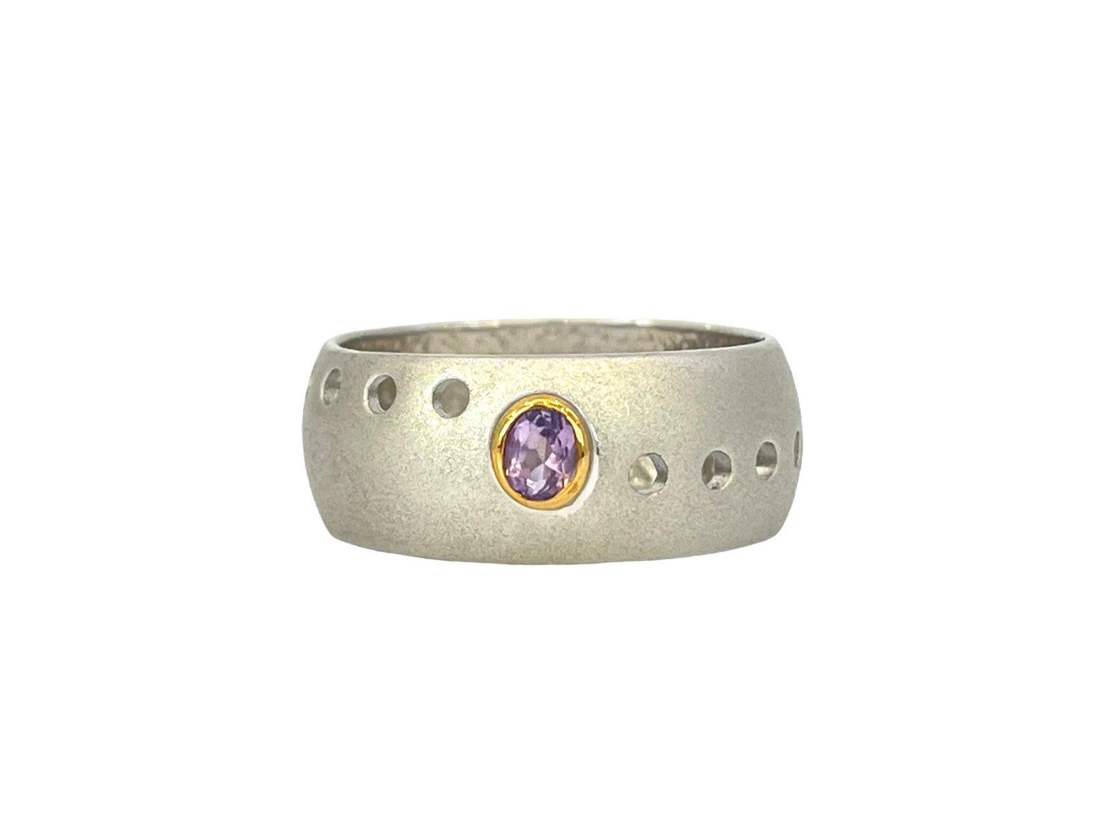 Silver ring with a purple gemstone on a white background