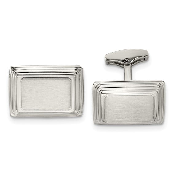 Silver rectangular cufflinks on a white background