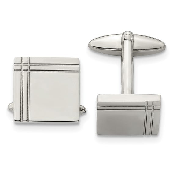 Pair of silver cufflinks on a white background