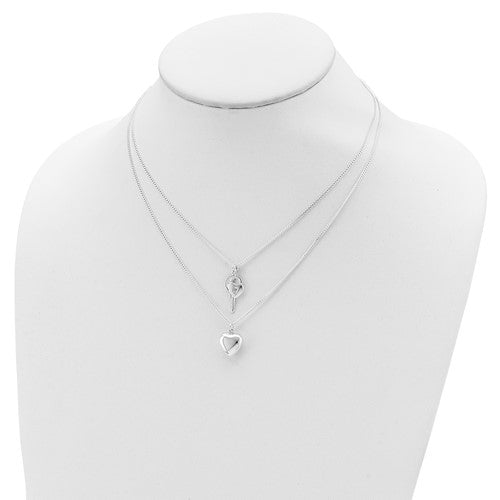 Silver necklace with a heart pendant on a mannequin neck.