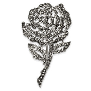 Decorative rose brooch with intricate design on a white background
