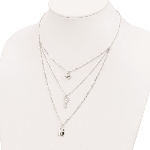 Layered silver necklaces on a mannequin with a white background