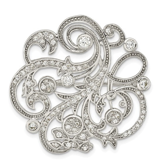 Decorative silver brooch with intricate designs and small crystals on a white background