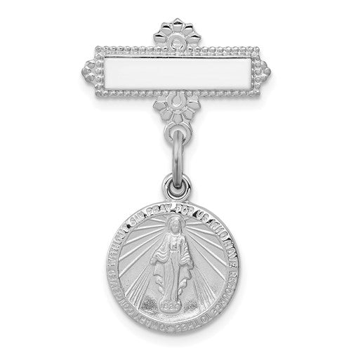 Silver religious pendant with a clear center on a white background