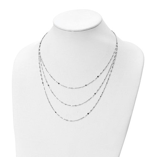 Necklace displayed on a mannequin bust against a white background