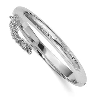 Silver bangle with intricate design on a white background