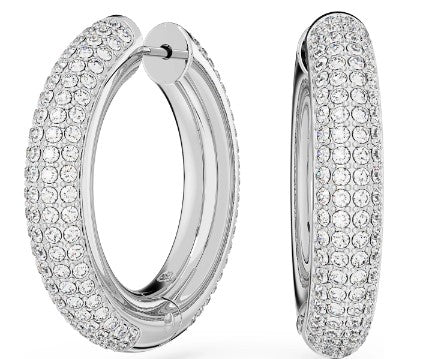 Silver hoop earrings with clear gemstones on a white background