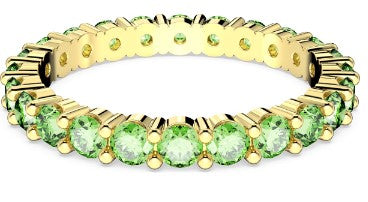 A gold-tone plated Swarovski Matrix ring with round cut green stones.