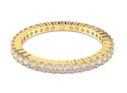 Gold ring with embedded diamonds on a white background