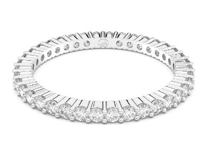 Diamond ring with baguette and round cut stones on a white background