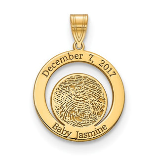 Gold pendant with fingerprint and engraved text on a white background