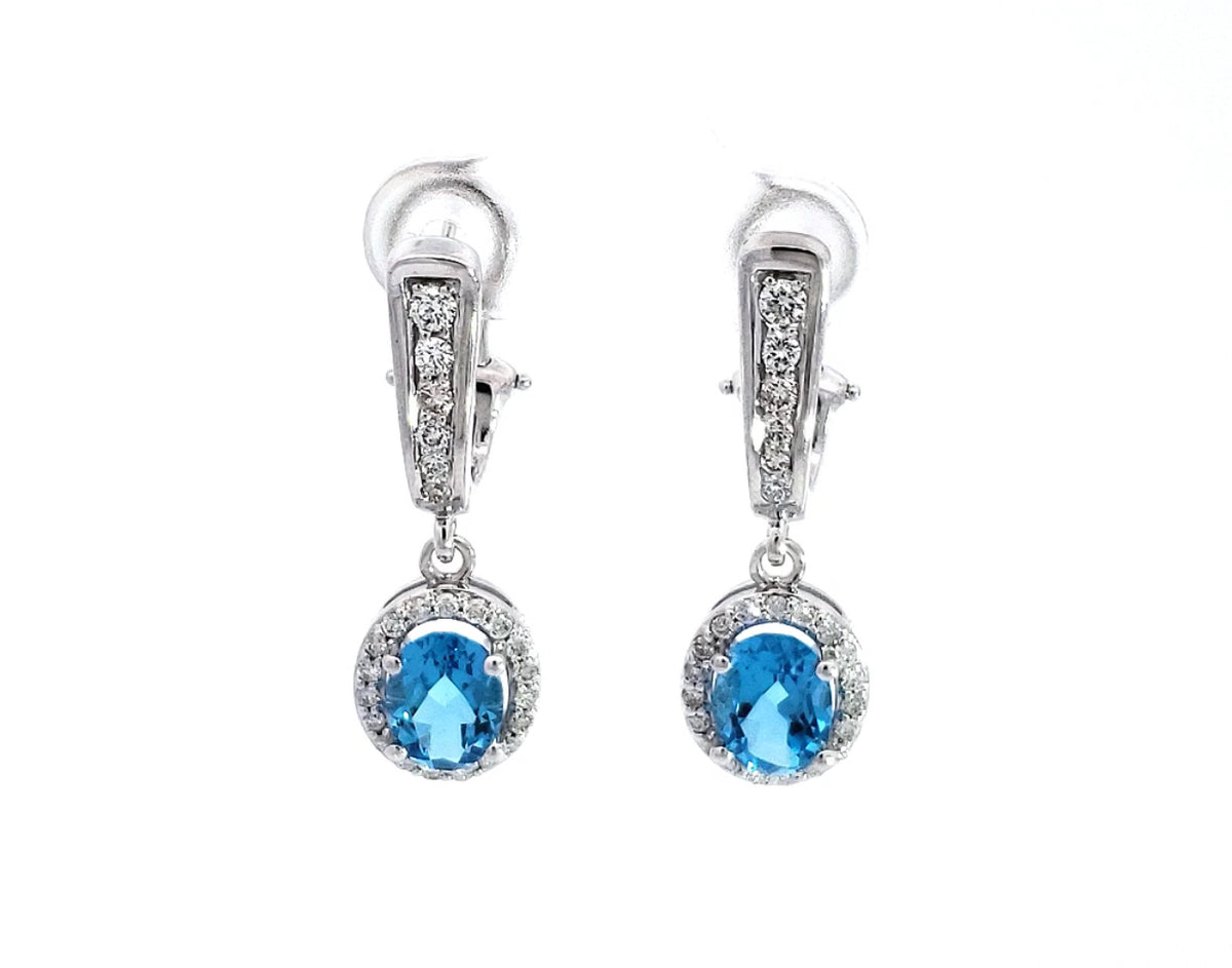 Aretes colgantes de diamantes y topacio azul en oro blanco de 14 quilates