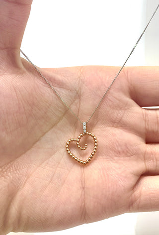 Colgante en forma de corazón con diamantes de 0,04 quilates en oro blanco y rosa de 10 quilates, 18"