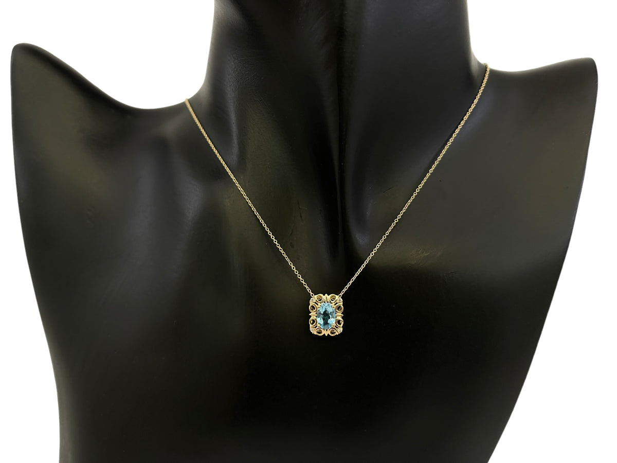 10K Yellow Gold 7x5mm Oval Cut Swiss Blue Topaz and 0.03cttw Diamond Necklace - 18 Inches