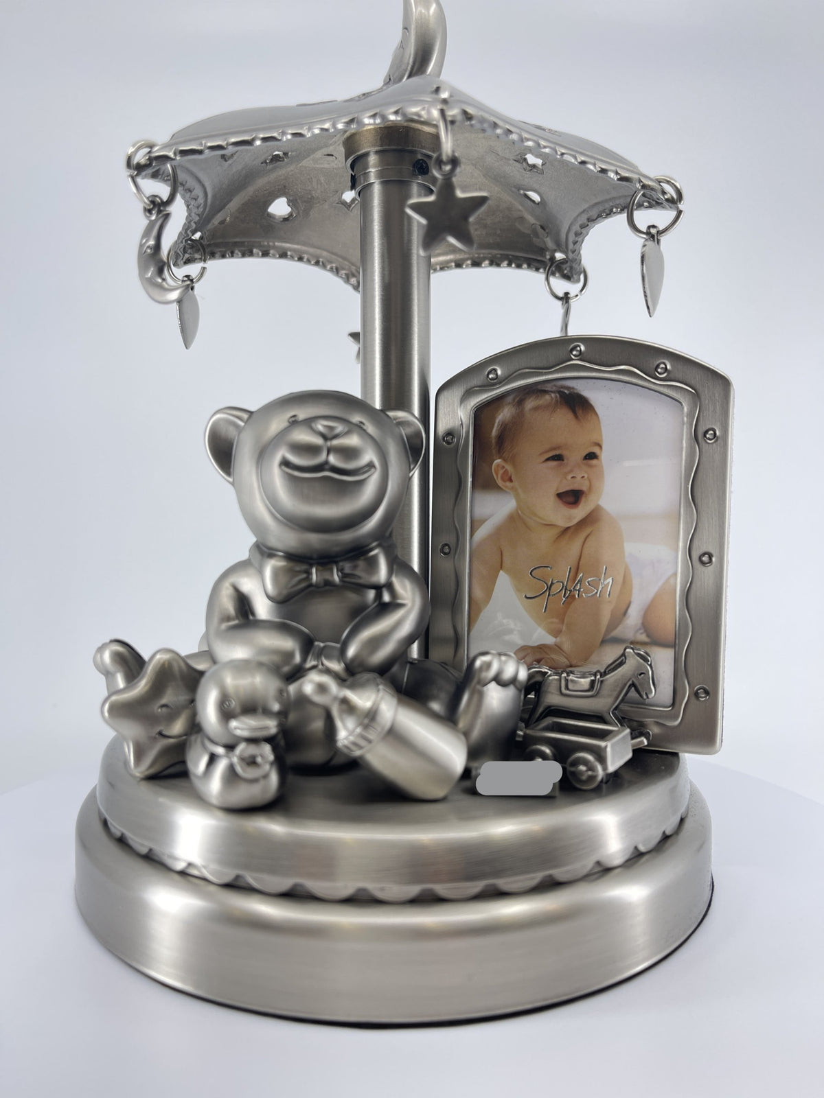 Carrusel musical de peltre para bebé con marco de fotos