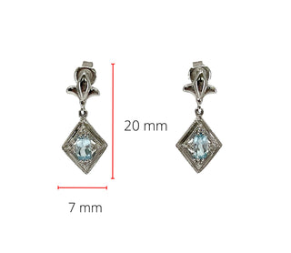 Pendientes de oro blanco de 10 quilates con topacio azul cielo genuino de 0,60 quilates y diamantes de 0,03 quilates