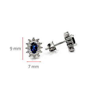 Aretes de oro blanco de 14 quilates con zafiro genuino de 0,55 quilates y halo de diamantes de 0,32 quilates