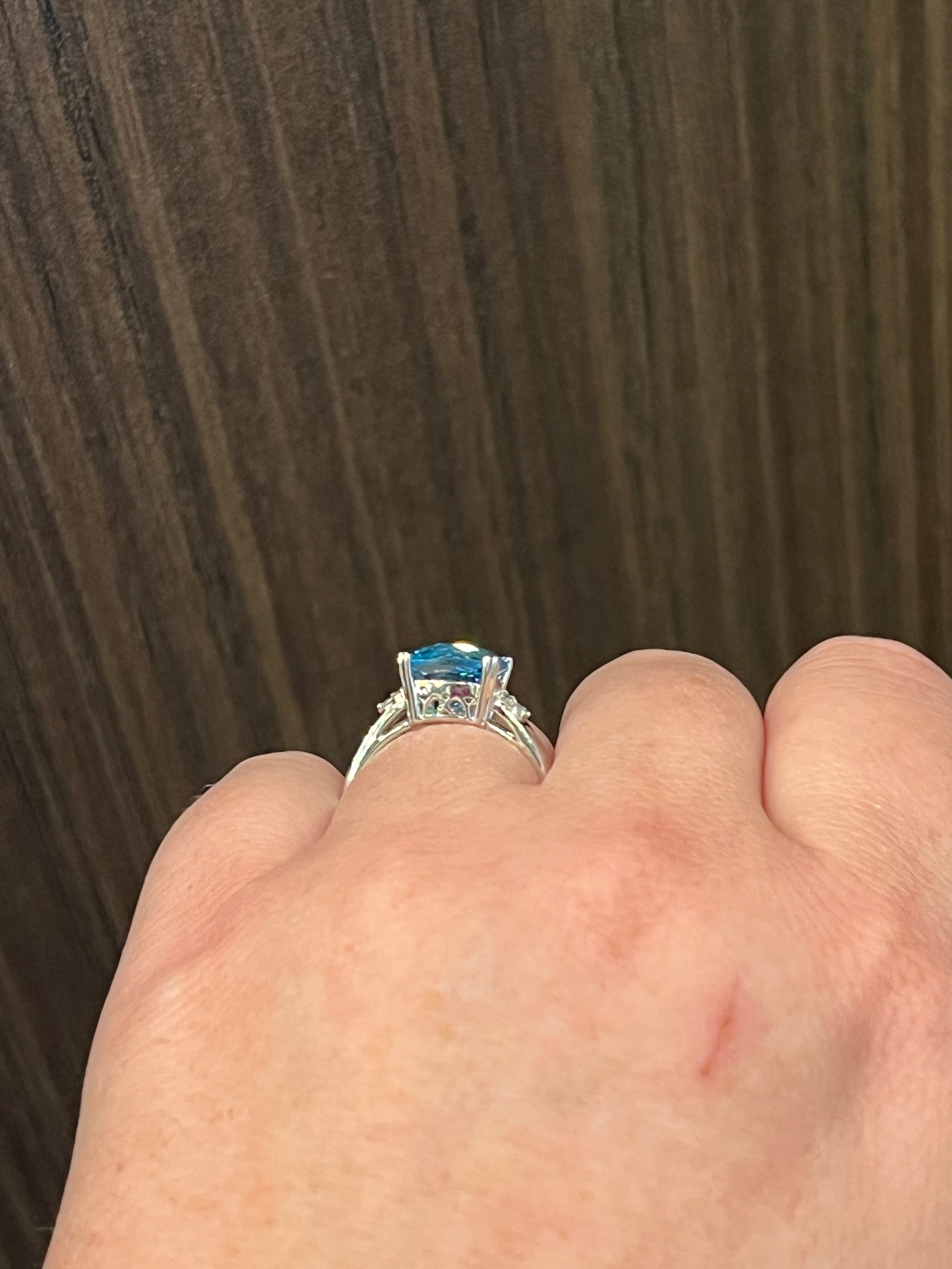 10K White Gold  9mm Blue Topaz and 0.10cttw Diamond Ring - Size 6 - 4.5