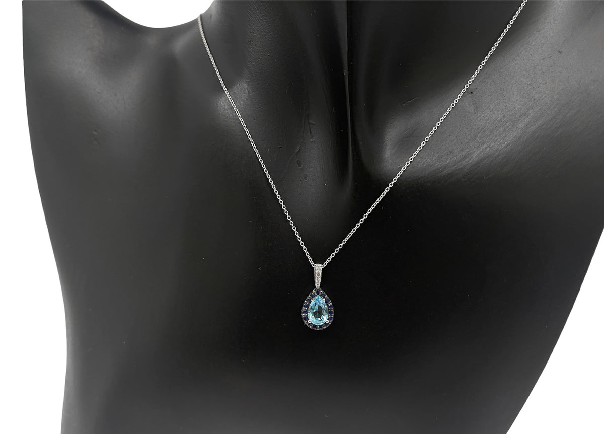 10K White Gold 7x5mm Pear Cut Sky Blue Topaz with Blue Sapphire Halo and 0.03cttw Diamond Necklace - 18 Inches