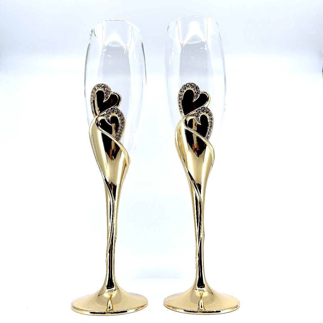2 copas de champán en tono dorado con diseño de corazón eterno