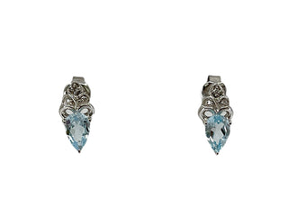 Aretes de oro blanco de 10 quilates con topacio azul suizo de talla pera de 6x4 mm y diamantes de 0,03 quilates