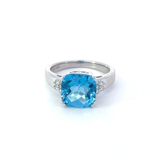 Anillo de oro blanco de 10 quilates con topacio azul de 9 mm y diamantes de 0,10 quilates - Talla 6